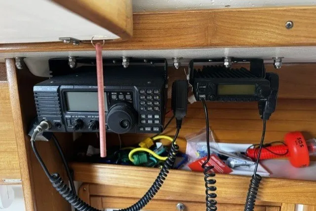 Radio equipment in a 2000 Catalina 320 sailboat cabin, featuring communication devices and accessories.