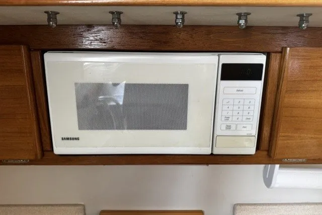 Built-in Samsung microwave in a 2000 Catalina 320 yacht kitchen.