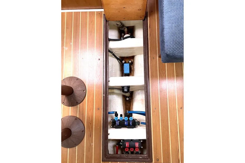 2004 Catalina 350 yacht interior showing underfloor wiring and components.