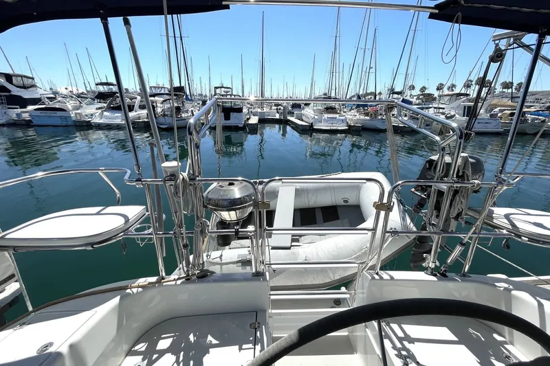 Cockpit view of a 2004 Catalina 350 sailboat docked in a marina.