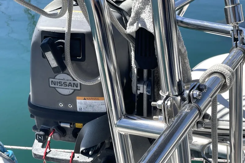Outboard motor on a 2004 Catalina 350 sailboat, featuring Nissan branding.
