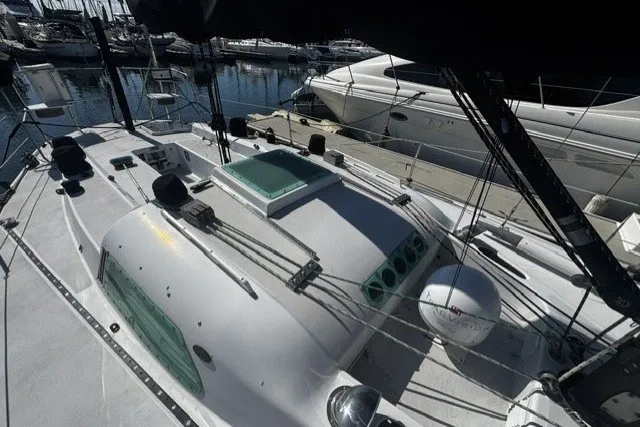 Sailboat docked in marina, Custom BILL LEE 40, 1973 model, with visible deck and rigging.