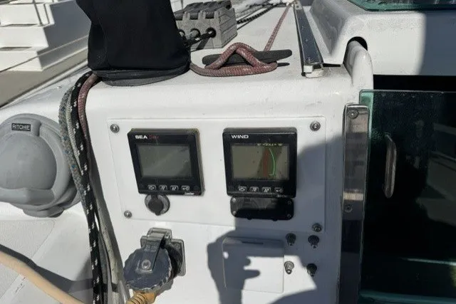 Cockpit instruments on a 1973 Custom BILL LEE 40 sailboat, featuring wind and sea data displays.