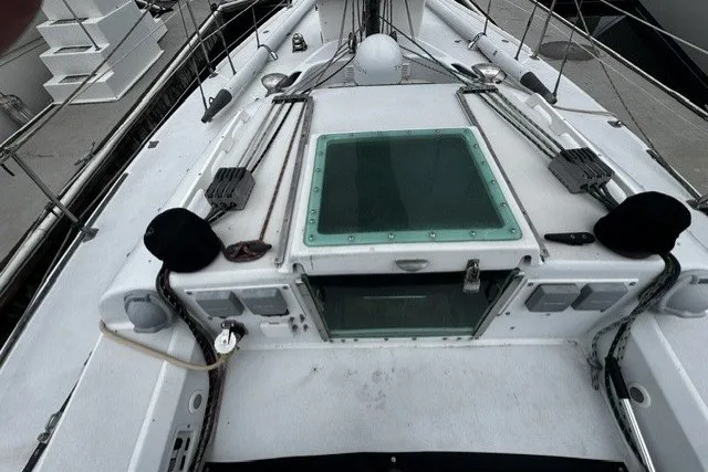 Deck view of a 1973 Custom BILL LEE 40 sailboat, featuring rigging and hatch.