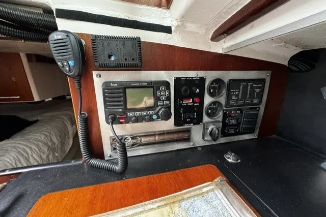 Control panel of a 1973 Custom BILL LEE 40 sailboat with radio and navigation equipment.