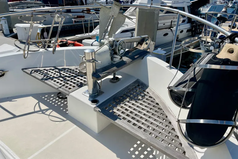 Deck of 1985 CHB 42 yacht with anchor and railing, docked at marina.