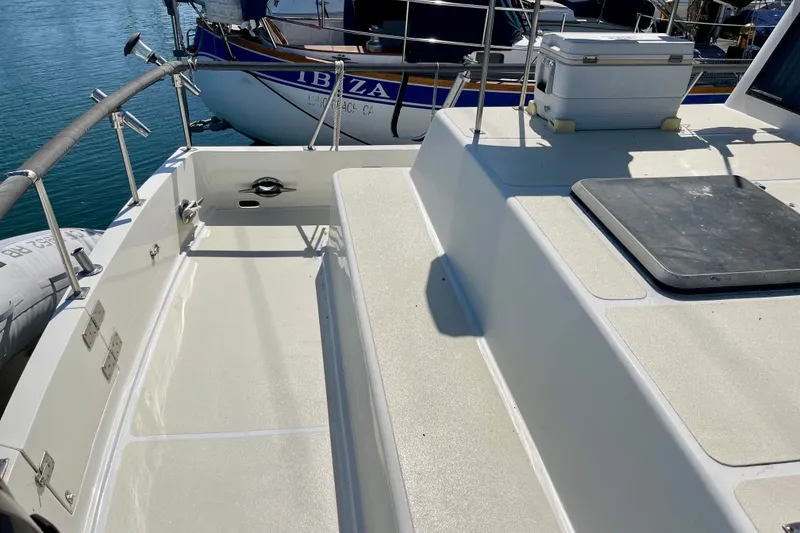 1985 CHB 42 boat deck with seating, docked near water.