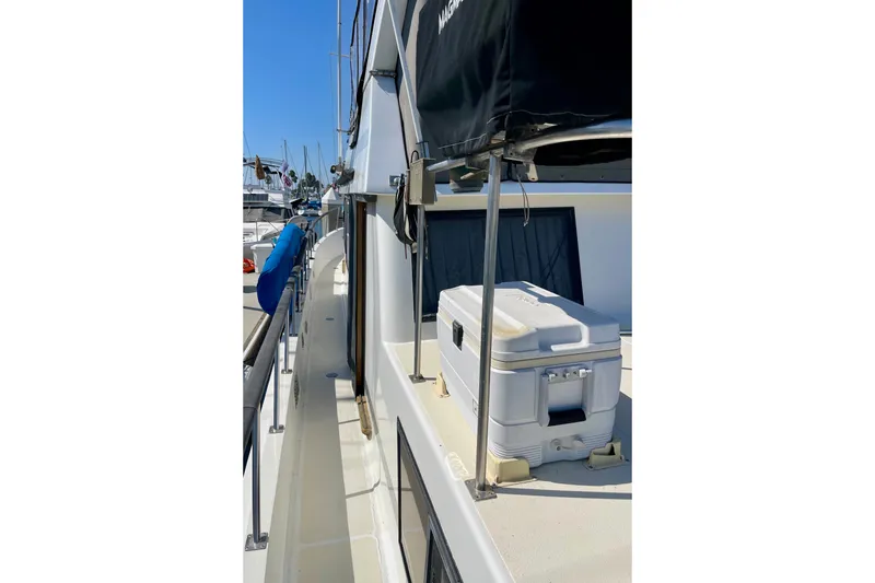 Side deck of a 1985 CHB 42 boat with cooler and railing.