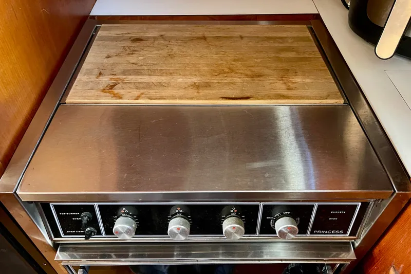 Stainless steel stove with wooden cutting board, CHB 42 model, 1985.