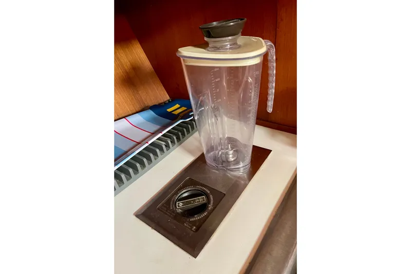 Blender pitcher on CHB 42 yacht counter, 1985 model, with nautical decor.