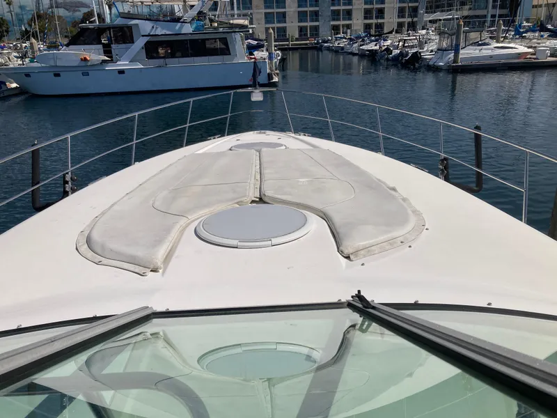 1999 Cruisers Yachts 3870 Esprit on water, marina background, view from bow.