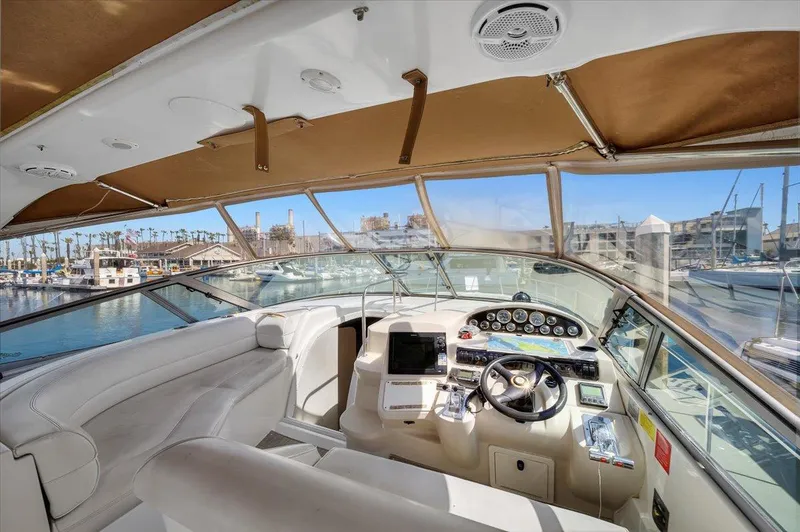 1999 Cruisers Yachts 3870 Esprit cockpit with luxurious seating and modern controls.