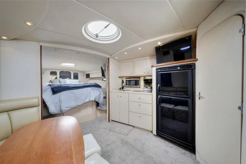Interior of 1999 Cruisers Yachts 3870 Esprit with kitchen and sleeping area.