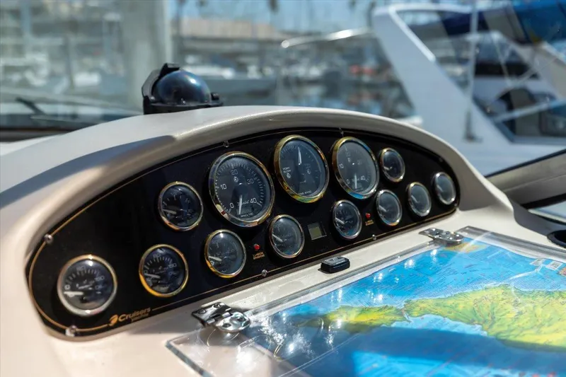 Dashboard of 1999 Cruisers Yachts 3870 Esprit with gauges and nautical map.
