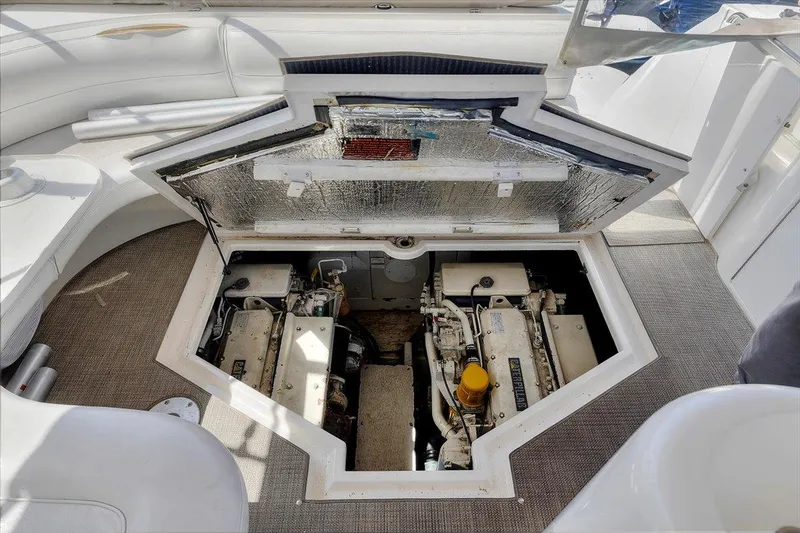 1999 Cruisers Yachts 3870 Esprit engine compartment with open hatch, showcasing dual engines.