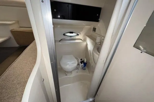 2001 Bayliner 2855 Ciera boat bathroom interior with toilet and sink.
