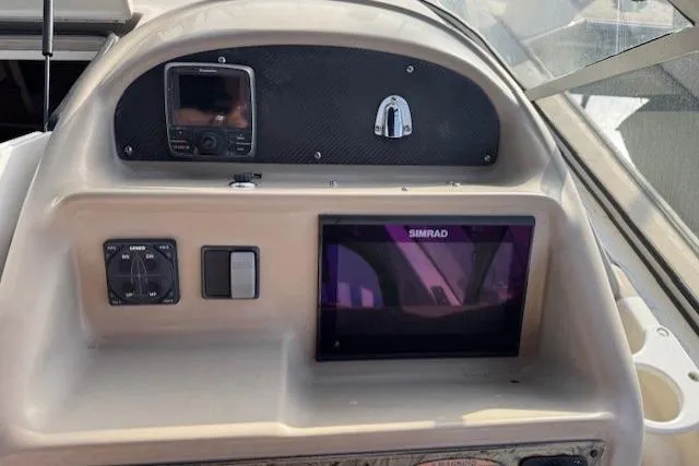 Dashboard of a 2001 Bayliner 2855 Ciera boat with Simrad navigation system.
